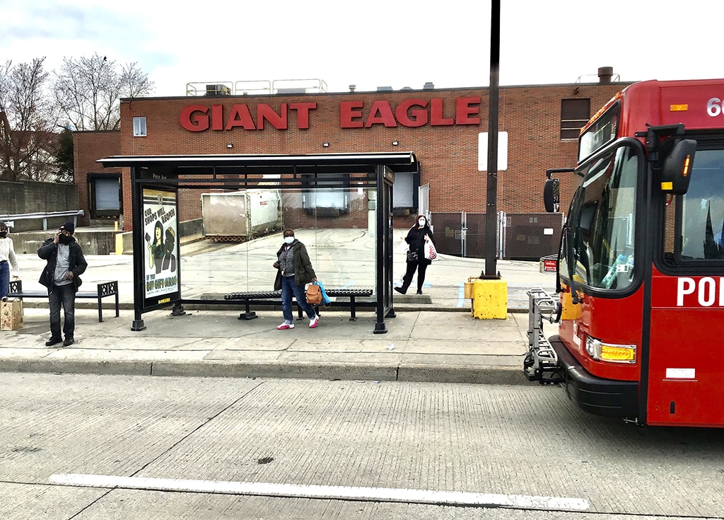 Port Authority bus at stop in front of Giant Eagle grocery store